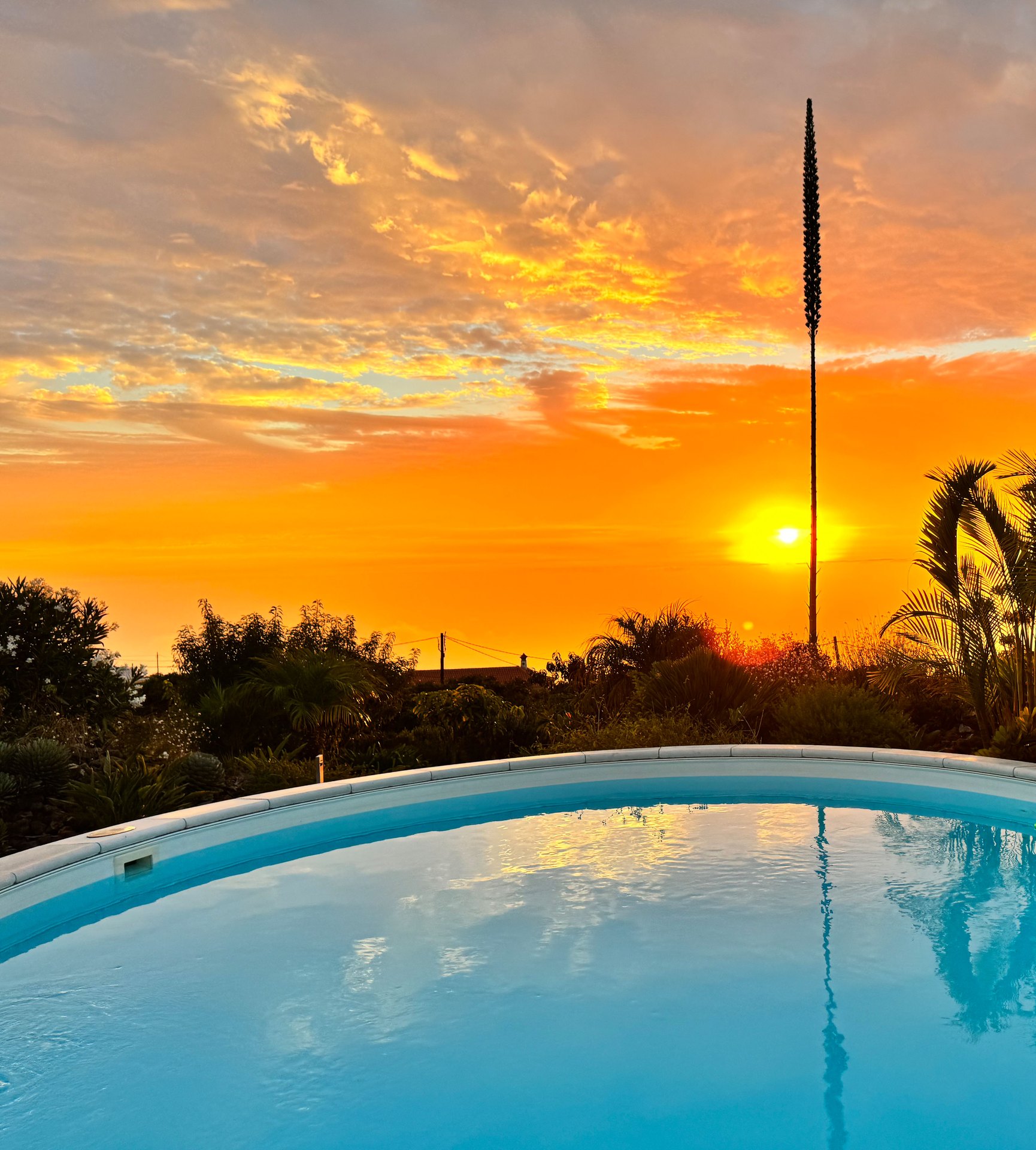 Orange evening sky above the pool
